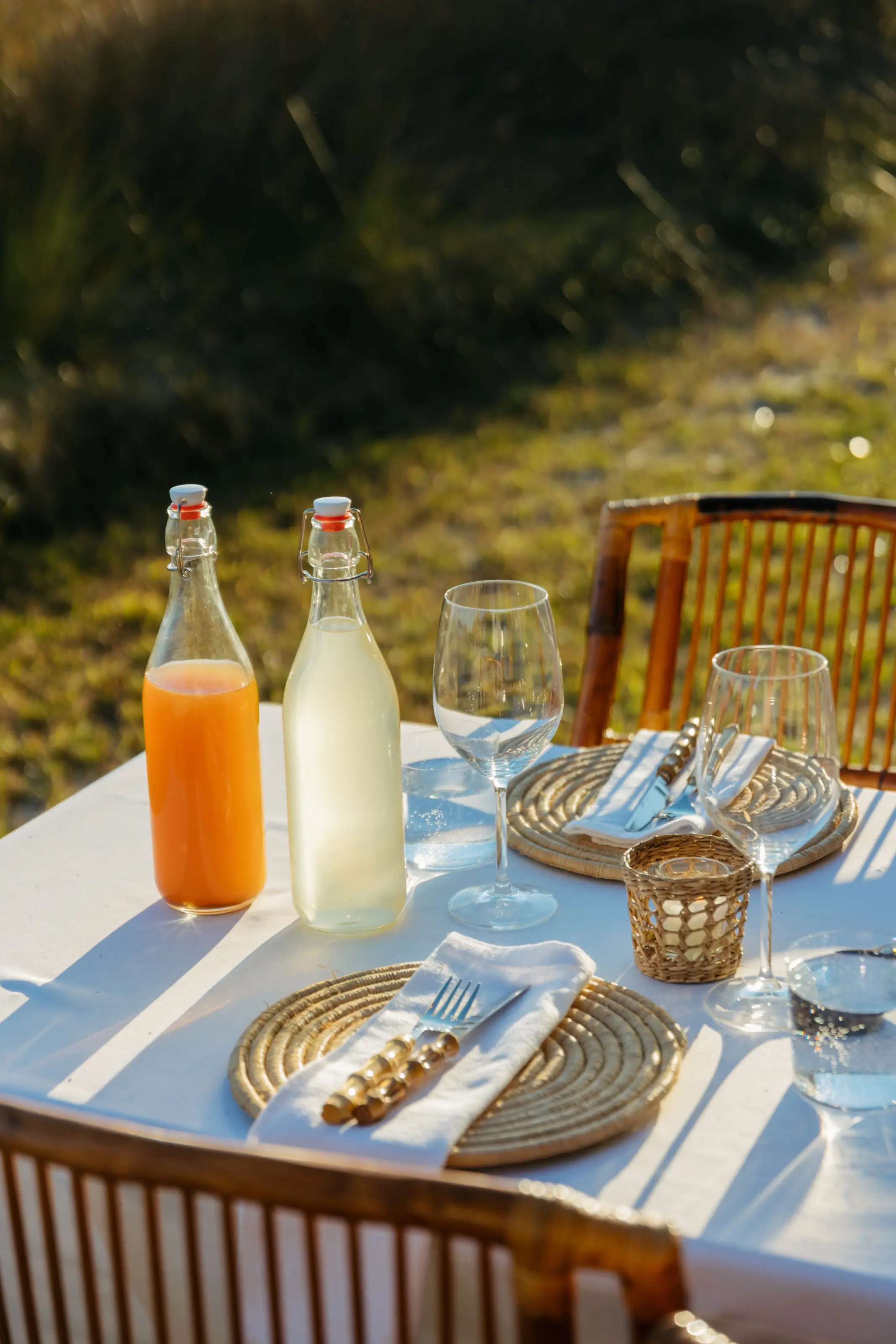Glassware and bottles on the linen.